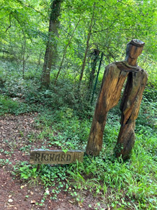 wooden statue in woods